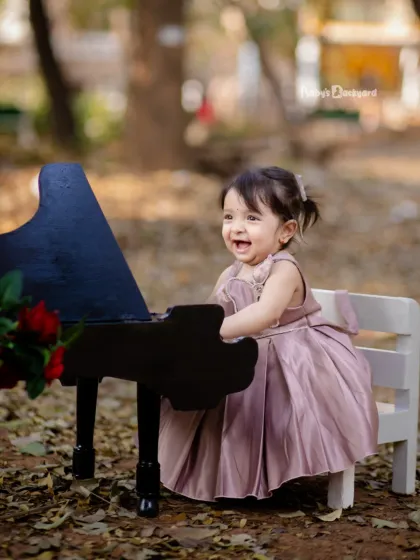 Playing the sweetest tune of happiness. Her joyful laugh is music to our ears.