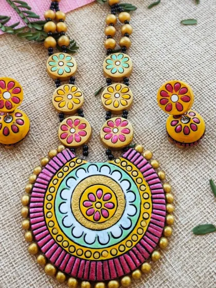 This version of the mandala and floral bead necklace is in a soft, pretty combination of pink, mint green, and yellow.