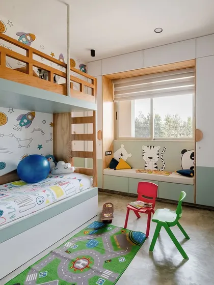 Designing for the youngest members of the family is always a joy. This children's room features a custom-built bunk bed to maximize play space, a cozy window seat for reading, and whimsical wall art to spark imagination.