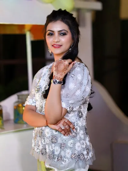 A guest's portrait, highlighting her smile and elegant pose. I ensure every guest who wants a photo gets a beautiful shot to remember the event by.