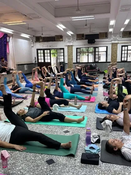 Celebrating International Yoga Day with our wonderful community. Here, students are practicing Supta Padangusthasana (Reclining Hand-to-Big-Toe Pose) to open the hamstrings.