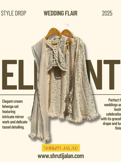 This elegant cream lehenga set features intricate mirror work and delicate tassel detailing. Its graceful drape and luxe finish make it perfect for weddings and festive celebrations.