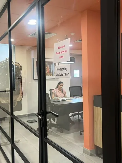 Here is a view of a private diet consultation in progress during a corporate wellness day. Creating a confidential space for employees to discuss their health is a key part of my on-site service.