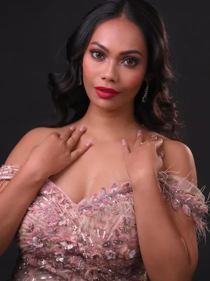 This pose shows the complete look, exuding confidence and glamour.