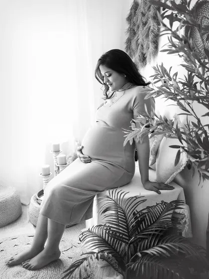 A serene, pensive portrait in black and white. This image, taken in my boho studio, shows how monochrome can create a sense of peace and timelessness.