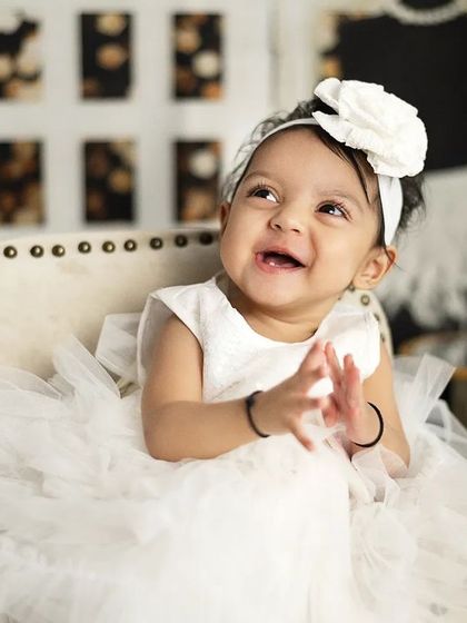 A happy, clapping moment from our fashion-themed shoot. We capture the fun and excitement of playing dress-up.