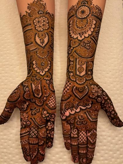 The full symmetrical design, held up to show the beautiful heart shapes created when the palms are brought together.