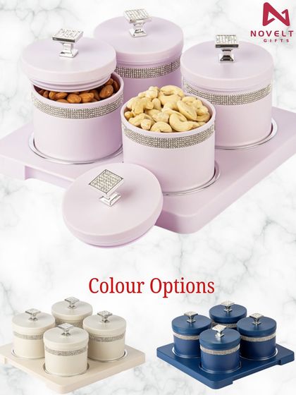 Add a touch of sparkle to your gifting with these elegant dry fruit containers. The pastel containers are adorned with a band of crystals and a matching crystal knob on the lid, available in several colors.