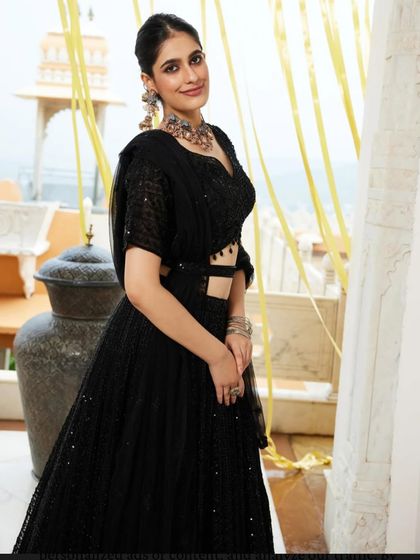 Another shot of the client in the black lehenga, looking effortlessly chic.
