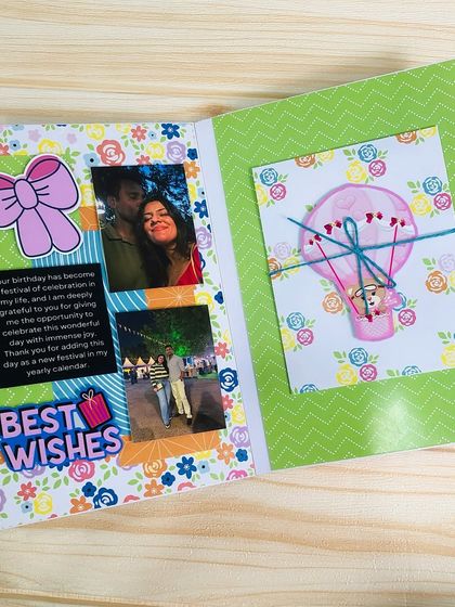 I love creating little interactive spots in my scrapbooks, like this small, tied-up card that can be opened to reveal a hidden message or photo.
