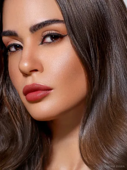 Glamour personified. A close-up beauty shot where the focus is on the perfect makeup, from the winged eyeliner to the matte lip.