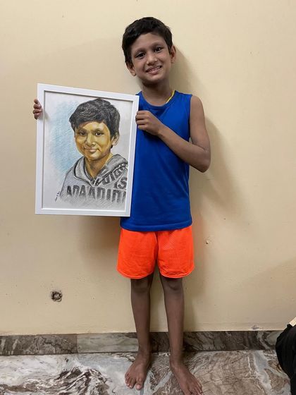 A happy moment seeing my nephew holding his finished portrait. Creating art for family is always extra special, and it’s wonderful to see the final piece framed and ready to be displayed.