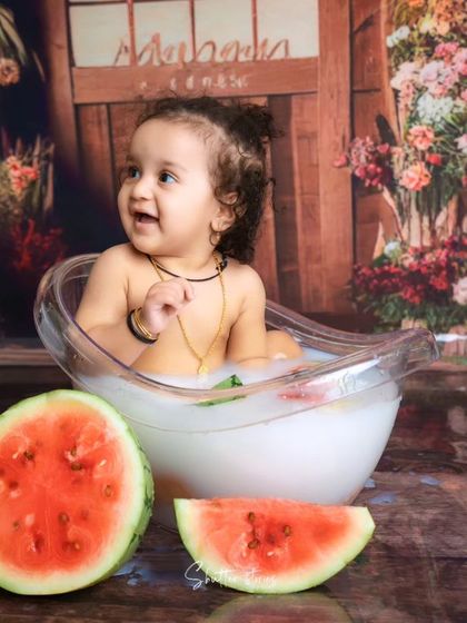 A fun watermelon-themed splash session, perfect for a summer baby!
