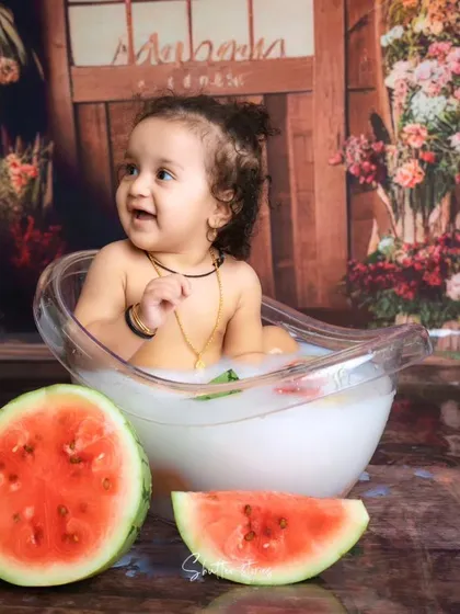 A fun watermelon-themed splash session, perfect for a summer baby!