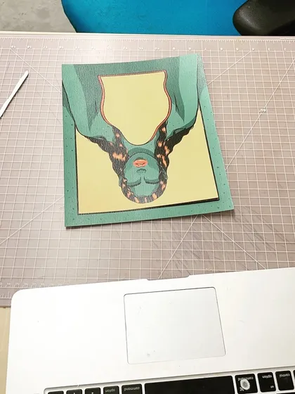 A process shot showing the assembly of one of the paper layers.