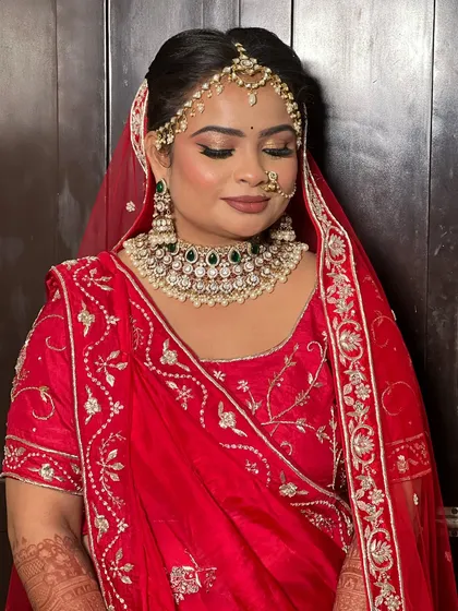 Another angle of the bride's serene look, showing the details of her matha patti and necklace.