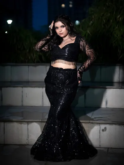 This shot shows the power of a complete look. From the stunning black sequin outfit to the confident pose, it’s an example of a full-length editorial portrait that’s perfect for a fashion portfolio.