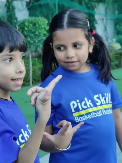 A candid conversation between two young players. Social interaction and communication are key life skills learned through team sports.