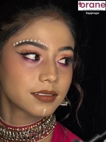 Another angle of the pearl-embellished makeup, highlighting the creativity we encourage in our students.