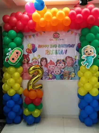 Here is a vibrant Cocomelon theme I created for a 2nd birthday party. This decoration package includes a custom printed backdrop with the birthday boy's name and colorful balloon pillars that frame the main party area, making it a perfect photo spot.