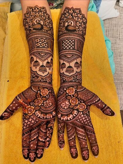 A beautiful design with peacocks, jhumkas, and roses.