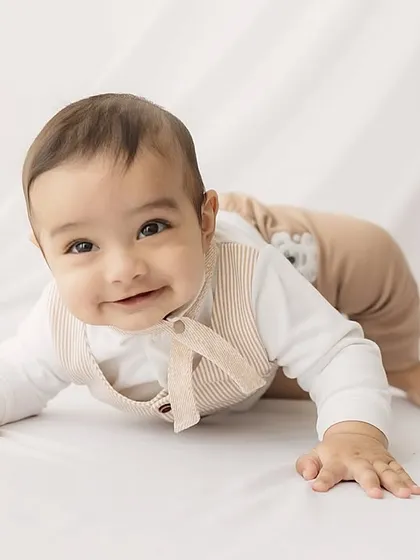 A happy, crawling-ready pose from the 6-month-old.