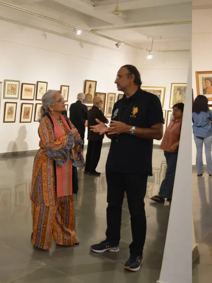 A lively conversation taking place at the opening of the Vidya Bhushan retrospective.