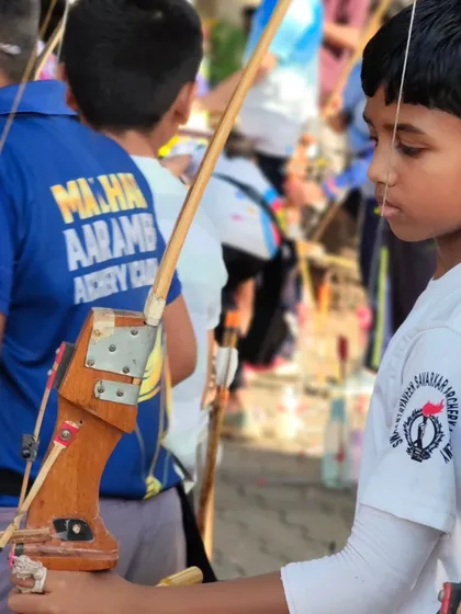 A close up of a young archer's focused expression. The concentration required for archery is a valuable life skill.