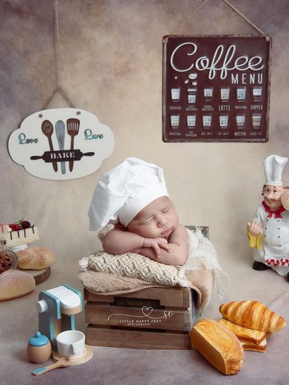 Here is our little master chef, taking a quick nap after a busy day in the kitchen. The chef's hat and bakery props create a full, imaginative scene.