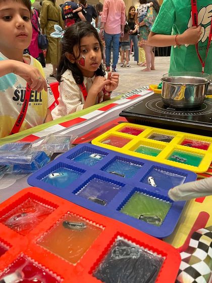 Kids watch with excitement as we prepare the molds for Hot Wheels soap making. This activity combines science and art in a really cool way.
