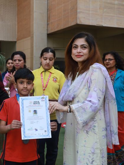 Our Principal awards a medal and certificate to a victorious student at the Annual Sports Day. We believe in recognizing and celebrating the achievements of our young athletes to motivate them to continue striving for excellence.