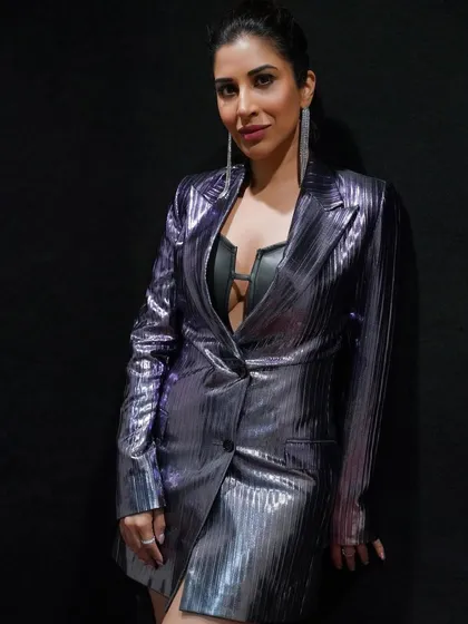 A second powerful look for Sophie Choudry in LSD2. This metallic purple blazer dress by Uzair Parvez Khan paired with a leather bralette creates an edgy, fashion-forward silhouette for her judge character.