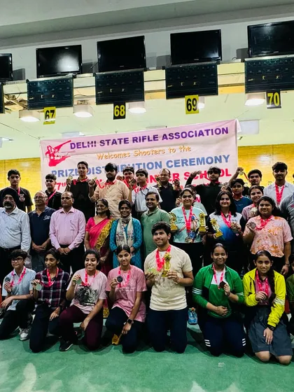 A group photo of all the winners at the Delhi State Interschool Shooting Championship. Our academy's shooters feature prominently, showcasing our success in nurturing young talent.
