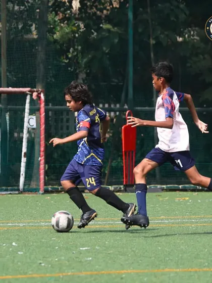 Dribbling with purpose. A Royal Rangers player advances the ball against an opponent, looking for a passing lane during The Winter Cup tournament.