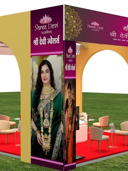 This is a 3D visualization for an exhibition stall for Shree Devi Jewellers. The design uses grand arches and a bold color scheme to attract visitors, with a layout that includes comfortable seating and secure display counters for a high-end experience.