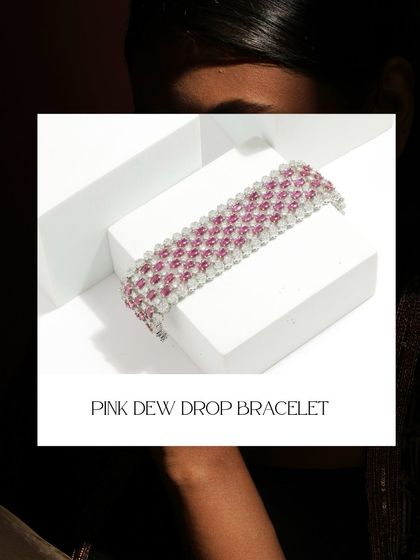A stylized shot of the Pink Dew Drop Bracelet, highlighting its intricate design and beautiful combination of pink tourmaline and diamonds.