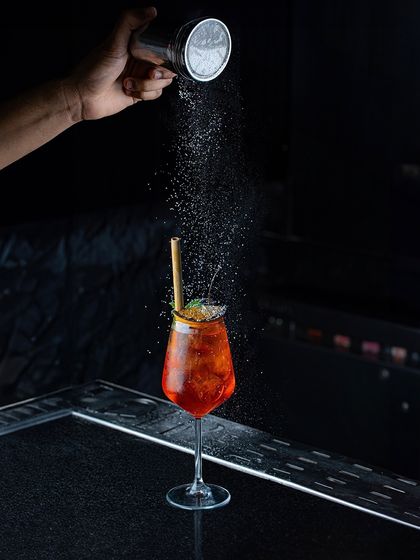 Blending unique ingredients with creativity and passion. Here, a final dusting of powder adds another layer of aroma and texture to one of our spritz-style cocktails.