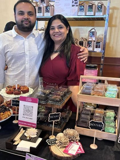 Another happy moment from my pop-up, posing with a loved one who came to support me. These events are a team effort, and I couldn't do it without my family.