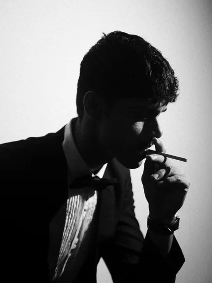 More from the black and white tuxedo series, exploring different poses and lighting angles. I used smoke and shadows to add texture and mood.