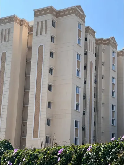 A photo of the nearly completed Love Home Jodhpur building. This image shows how the architectural details and color scheme from the render have been faithfully executed in the final construction.
