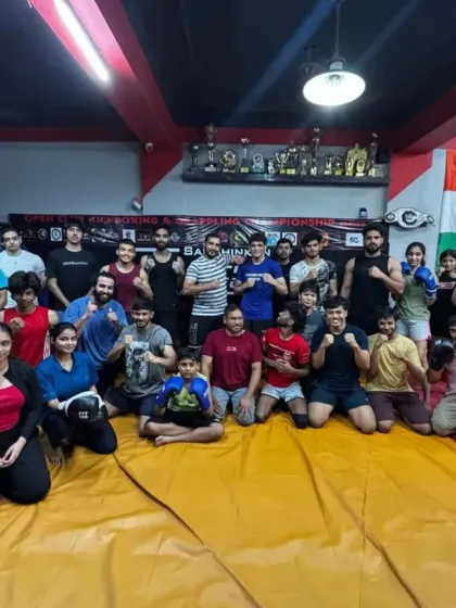 A group photo after a successful open fight camp held at our gym. We foster a collaborative environment where fighters can learn from each other.