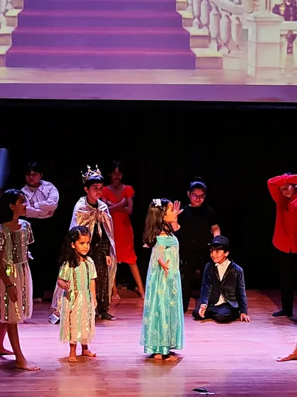 A full-cast scene from a fairytale production. This showcases the culmination of our teamwork, with every child playing their part in the larger story.