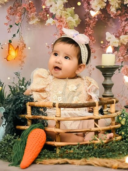 A whimsical and dreamy portrait in a floral basket. This setup combines rustic charm with soft, romantic florals for a unique look.