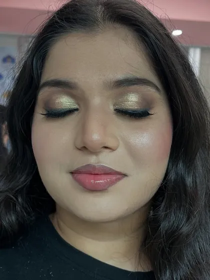 The same soft glam look with eyes closed to showcase the beautiful gold and brown eyeshadow blending.