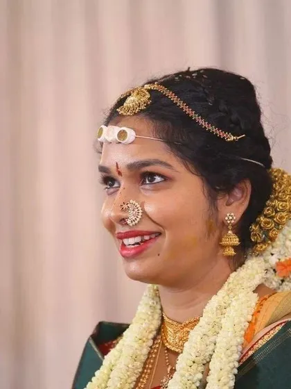 There's nothing more rewarding than seeing a bride's happy smile. This candid shot captures the joy and radiance of a bride on her big day, a look we created together to feel natural and beautiful.