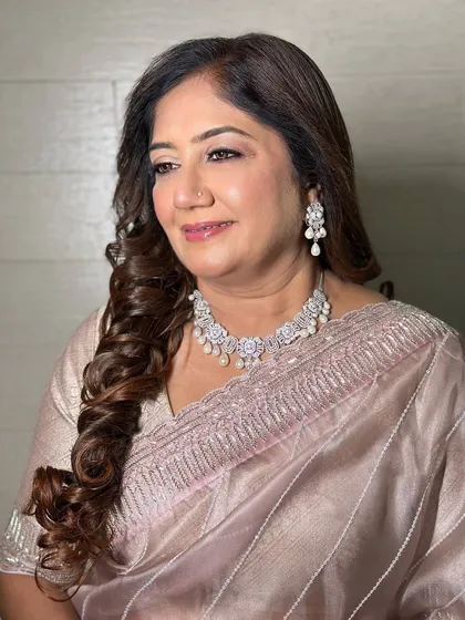 A smiling portrait of this elegant lady. The dewy makeup and soft curls create a look that is both timeless and beautiful.