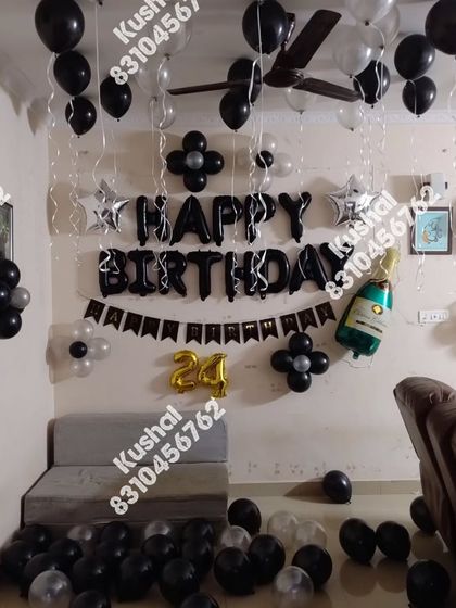 A black and silver themed birthday setup, perfect for a stylish celebration.