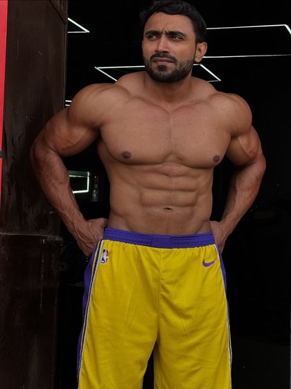 In the hearts of my people. A relaxed pose showing a lean physique.