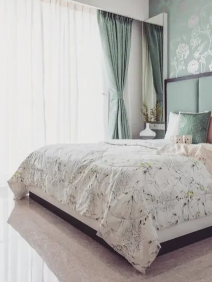 A bedroom should be a sanctuary. We helped select this calming sage green palette, pairing a solid colour with a delicate floral accent wall to create a peaceful and elegant atmosphere.