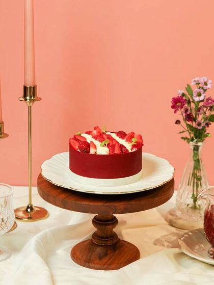 Our Strawberry Toffee Gateaux, a perfect blend of fluffy vanilla, fresh strawberries, and creamy frosting.